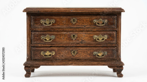 Antique Wooden Chest of Drawers with Ornate Metal Pulls 1.