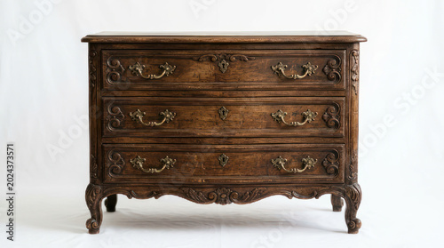 Ornate Antique Wooden Dresser with Three Drawers on White.