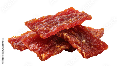 Schilderij op canvas Pile of savory red meat jerky strips seasoned with spices, isolated on transpare