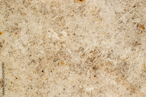 Photos High-detailed abstract background of a light beige, scratched, and stained rough surface, mimicking old cement, plaster, or weathered wood