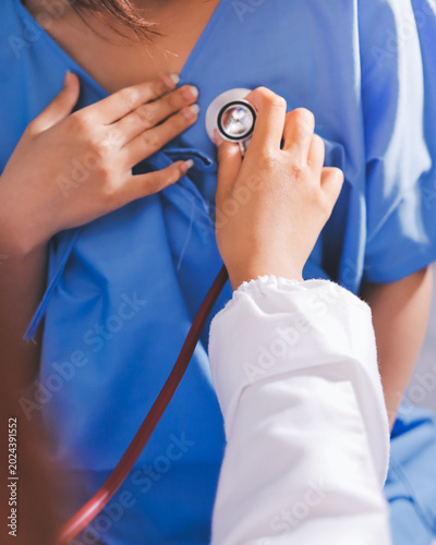 Doctor using a stethoscope checking patient with examining, presenting results symptom and recommend treatment method, Healthcare and medical concept