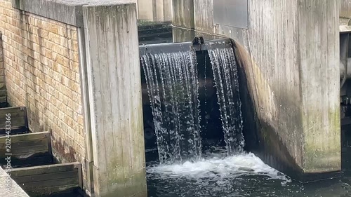 Water flowing through concrete fish ladder dam