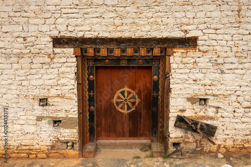Tachog Lhakhang Bhutan, wooden door with bhutanese decoration at Tachog Lhakhang entrance