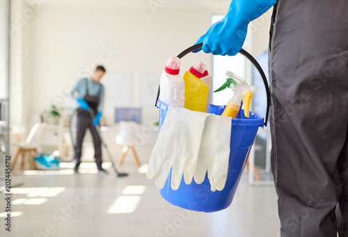 Obraz na plátne Cleaners team office cleaning service with bucket