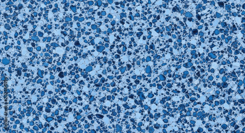 Abstract blue-gray granular pattern with irregularly shaped dark accents texture dots