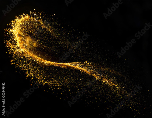Golden Swirl of Glittering Particles on Black Background.