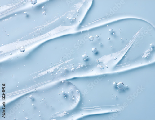 A captivating close-up reveals the fluid dynamics of a translucent gel-like substance with embedded bubbles.