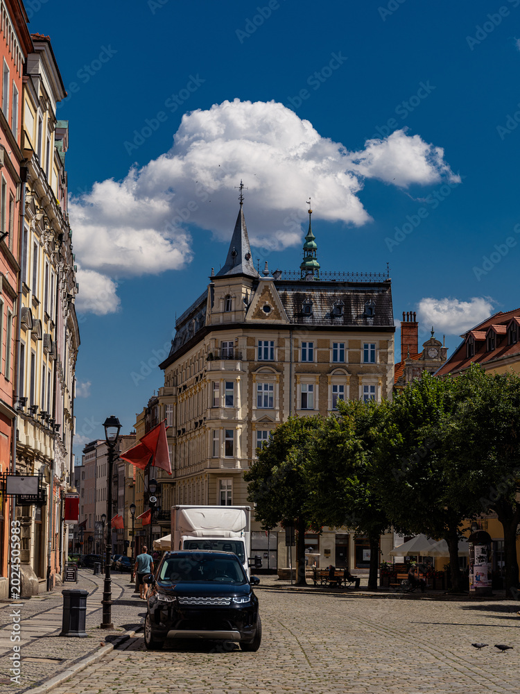 Fototapeta premium 2025-07-20; Historic tenement house and street view in Swidnica Poland.