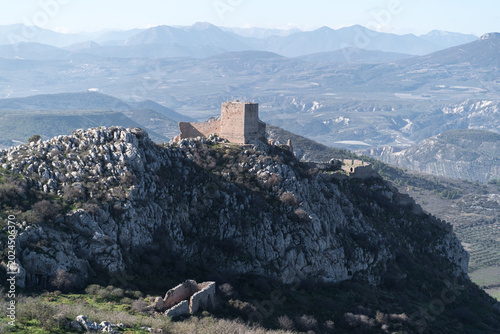 фотографія Ancient castle ruins on a rocky mountain overlooking a valley in Akrokorint Gree