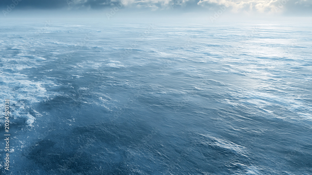 Fototapeta premium Calm Ocean Surface with Blue Sky and Clouds - Tranquil Seascape Photography of the Pacific Ocean's Natural Beauty