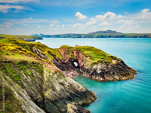 Εκτύπωση καμβά Castell Heinif Fort, Ramsey Sound, Pembrokeshire, blue sea, azure sky, fluffy white clouds,  a beautiful part of the Pembrokeshire coastline, seen from the Wales coast path