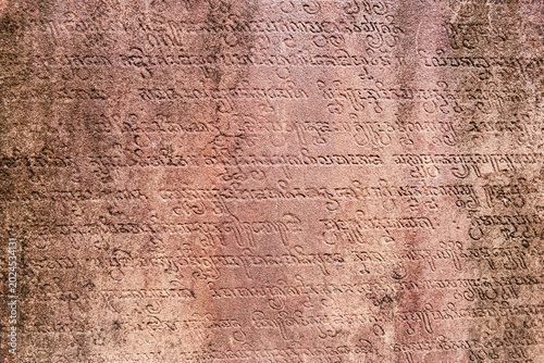 Fotografie Cham script inscription on stone at My Son ancient temple ruin archaeological site