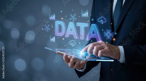 Businessman Using Tablet to Analyze Data with Futuristic Visualizations and a Blurred Background