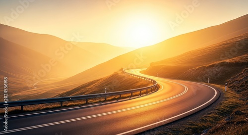 A winding asphalt road stretches across a peaceful valley toward a vibrant sunrise, disappearing into the hazy golden light at the horizon, transport, hills, background