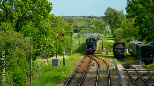 Obraz na płótnie Swanage steam railway with steam train coming into station in Dorset