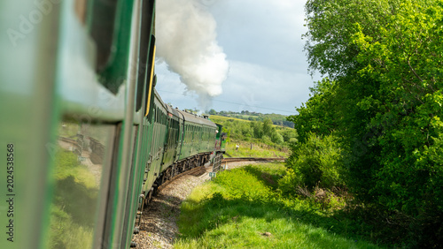 Swanage steam railway with steam train coming into station in Dorset