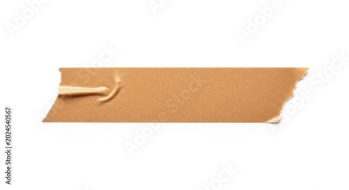 A single strip of brown paper tape with jagged torn ends and subtle adhesive texture is isolated on a clean, minimalist white background, jagged, rough, mask