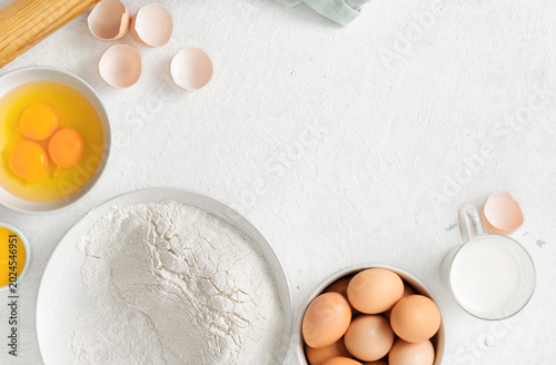 Baking ingredients with flour and eggs flatlay