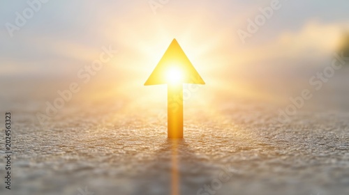 Golden Arrow Pointing Upwards Towards Sunlight