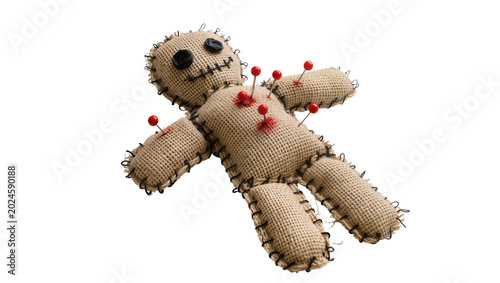 Photos Isolated spooky voodoo doll made from burlap fabric, black button eyes, pierced