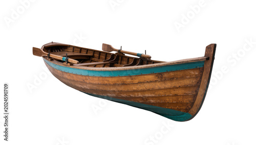 Obraz na plátně Isolated traditional wooden rowboat with oars, classic vintage small boat for tr
