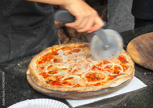 Cutting a Pizza with a Pizza Cutter
