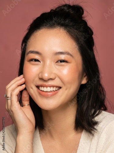 Happy young asian woman smiling with natural makeup