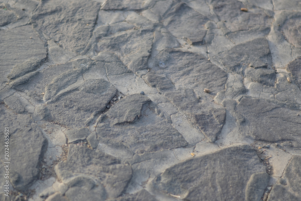Fototapeta premium Rough stacked stone wall background texture