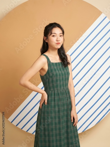 Young asian woman wearing a simple dark summer dress