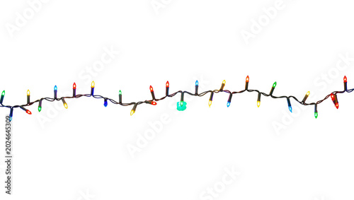 Tableau sur toile Isolated brightly lit string of multicolored holiday Christmas lights for festive decor