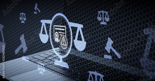 Digital legal warning concept with holographic icons of law scales and certificates displayed over a laptop keyboard representing online compliance and security issues