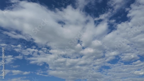 Soft White Clouds Floating Across Blue Sky Timelapse