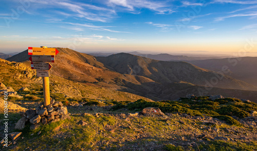 beautiful scenic view on summit mountain from a trail with hiking pole  in Sa...