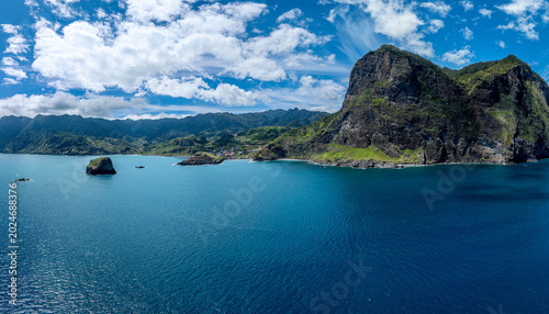 Fotografie Aerial drone view of the Madeira coastline with steep cliffs, Atlantic Ocean, and natural landscape