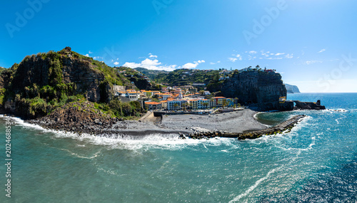 Photos Aerial drone view of the Madeira coastline with steep cliffs, Atlantic Ocean, and natural landscape