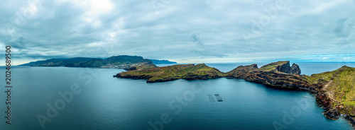 Photos Aerial drone view of the Madeira coastline with steep cliffs, Atlantic Ocean, and natural landscape