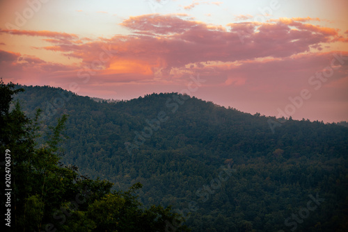 The natural background of the beautiful twilight sky, the surrounding atmosphere (trees, rivers, mountains) is a beautiful view of the journey, the view point.