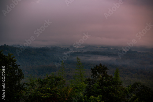 The natural background of the beautiful twilight sky, the surrounding atmosphere (trees, rivers, mountains) is a beautiful view of the journey, the view point.