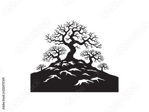 Cuadro en lienzo A detailed silhouette photo of a group of gnarled winter trees resting upon a sm