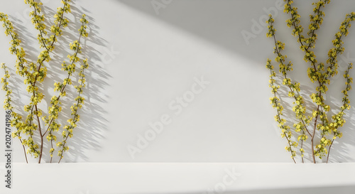 Minimalist studio wall with delicate yellow blossoms on white background