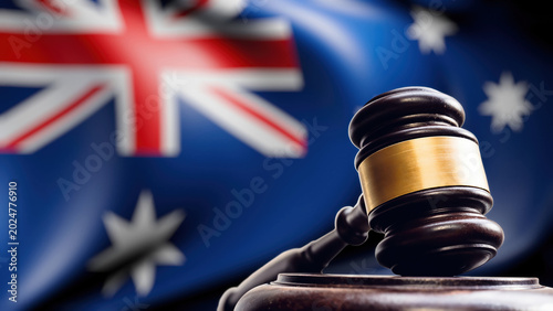 Australian legal system conceptual gavel with national flag background