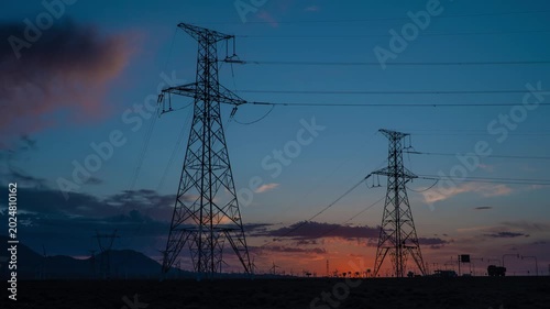High Voltage Transmission Towers at Sunset
