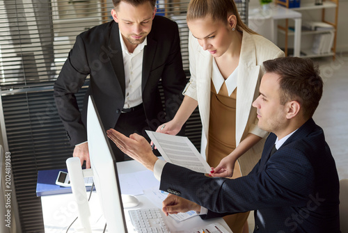 Canvas Print Business team analysts in office meeting discussion report
