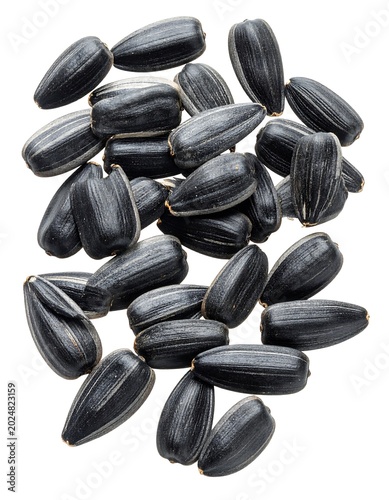 Close up of numerous sunflower seeds isolated on a white background