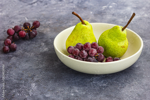 Healthy Pear and Grape Arrangement on Rustic Background