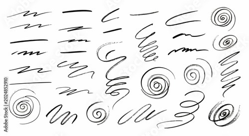 Collection of hand drawn swirling lines and spirals.