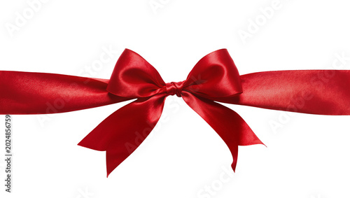 Obraz na płótnie Isolated red satin ribbon bow gracefully tied for a festive gift or elegant decoration