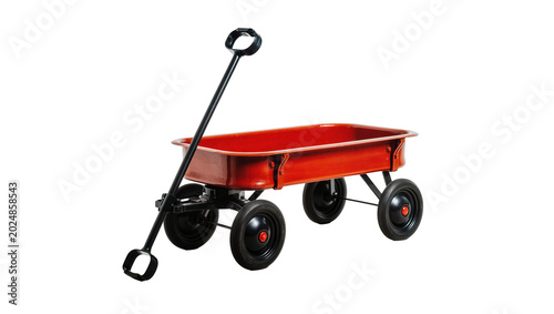 Foto Isolated classic red wagon with black handle and wheels, vintage utility cart