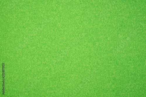 Fotografia Bright green textured surface creating a vibrant abstract background