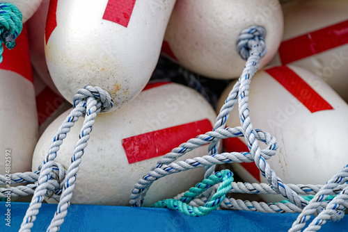 Close up view of red and white buoys in a pile
